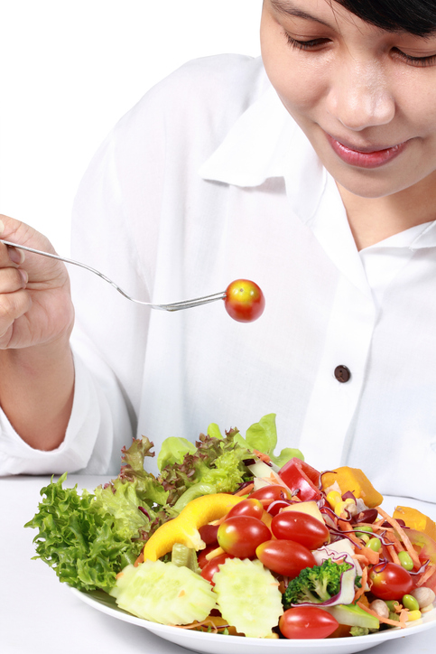 a woman holding a plate of food